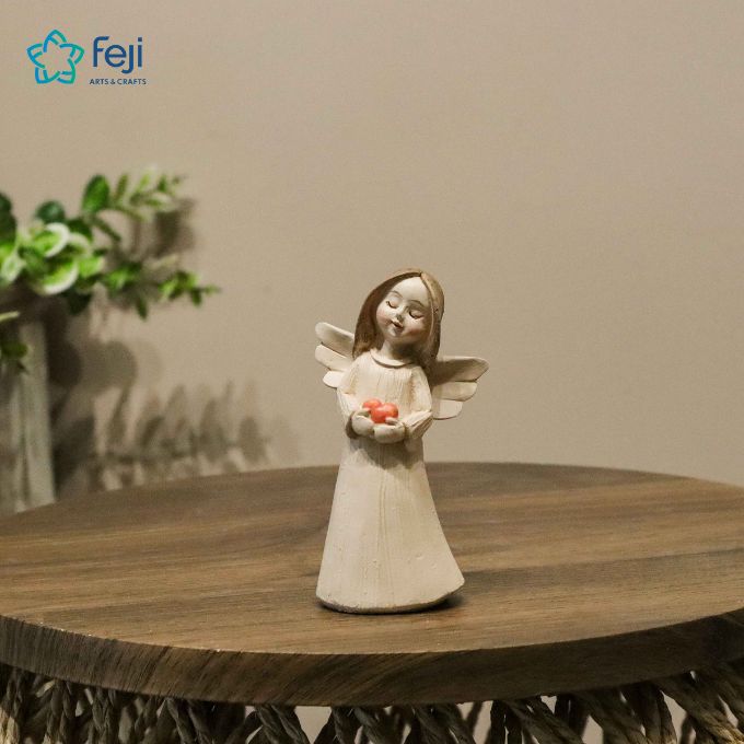 Angel Holding Heart Figurine